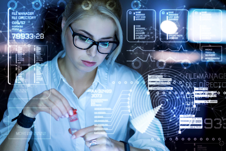 Calm young tired programmer having a strange sudden pain and looking concentrated while taking a special pillの写真素材