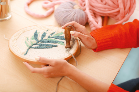 Beautiful ornament. Handy creative needlewoman feeling rather overloaded while stitching beautiful ornamentの写真素材