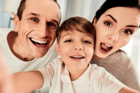 Great mood. Selfie of a happy united family while being in a wonderful moodの写真素材