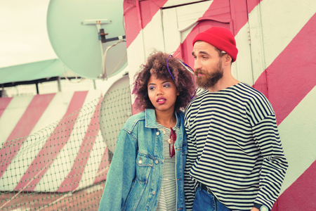 Sleepy couple. Young tired couple wearing casual clothes and feeling sleepy after partyの写真素材