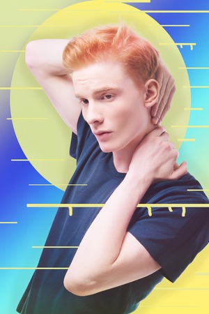 Thoughtful person. Calm professional designer putting his hands behind his neck and thinking about a new conceptの写真素材