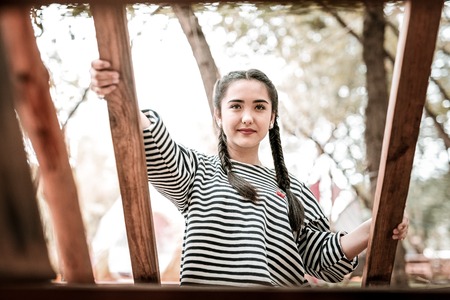 Love nature. Amazing brunette girl expressing positivity while looking forwardの写真素材