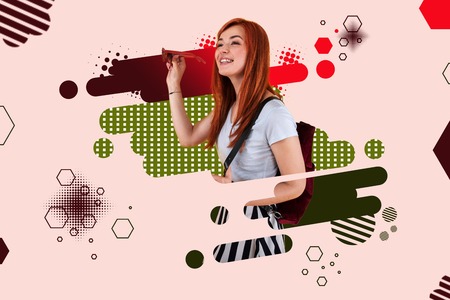 Bright backpack. Beaming red-haired smiling girl wearing bright backpack standing ahead of graphic ground with patternsの写真素材