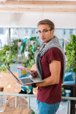 Interior designer. Modern famous interior designer feeling busy choosing suitable colors for his new projectの写真素材