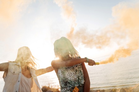 Going crazy. Cheerful stylish young woman with white dreadlocks going crazy with her boyfriendの写真素材