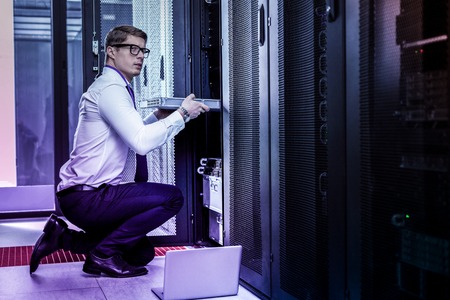 Information theft. Nice smart man taking the server while stealing the database