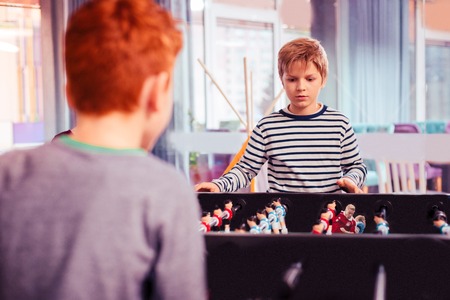 One game. Two kids preparing for the game, taking positionsの写真素材