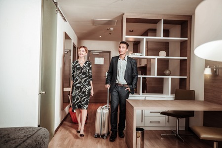 Couple of businessmen. Couple of businessmen coming to nice hotel room having vacation