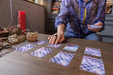 Prediction of future. Close up of tarot cards lying on the table while predicting the future