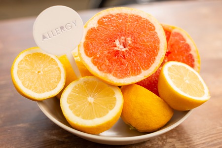 Citrus fruits. Top view of citrus fruits having some allergic components standing on the tableの写真素材