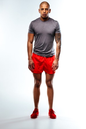 Comfortable sportsweat. An athlete wearing red and grey summer sport suitの写真素材