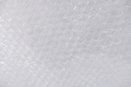 Causing garbage overloading. Clear transparent textured plastic wrap with pimpled side participating...