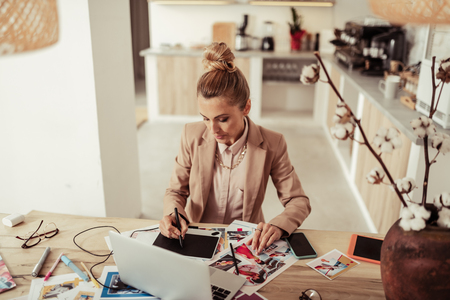 Sketching work. Concentrated on her project designer drawing sketches for the new collection.の写真素材