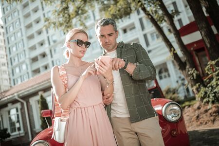 Looking for advice. Concentrated husband and wife searching information about their car in Internet...