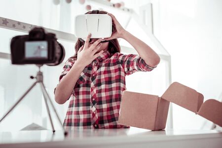 Other dimension. Beautiful nice girl being in the virtual reality while wearing 3d glasses
