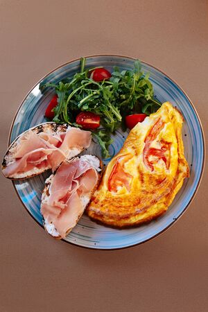So appetizing. Top view of a plate with delicious food while standing on the tableの写真素材
