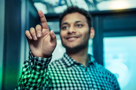 Sensory technology. Selective focus of a male hand touching the screen while working with sensory...