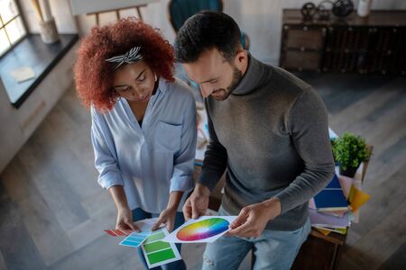 Talented interior designers. Two talented professional interior designers choosing color for projectの写真素材