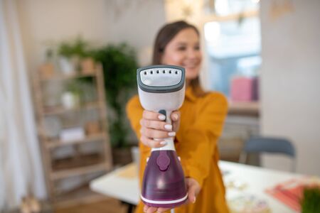 Professional steamer. Selective focus of a clothes care device while being shown to youの写真素材