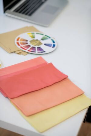 Different colors. Top view of fabric samples of different colors lying on the table