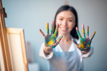 Artists hands. Hands of a good looking young woman being shown to youの写真素材