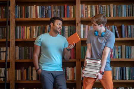 Together. Two young men spending the day in the library together