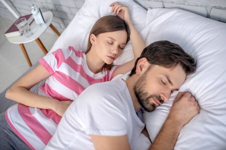 Sleeping. Pregnant young woman and her husband sleepingの写真素材