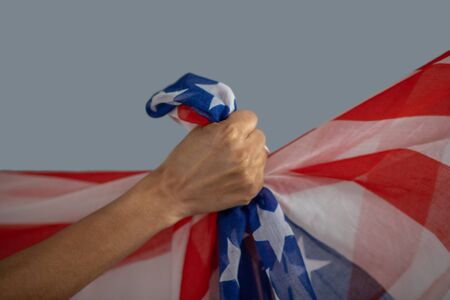 Equal rights. Close-up of dark-skinned female hand clutching usa flag