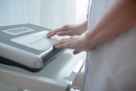 Medical equipment. Close up picture of medical equipment and human hands touching it