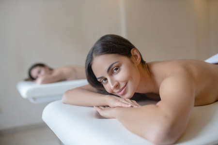 Waiting for massage. Close up picture of a woman lying on a couch before massageの写真素材