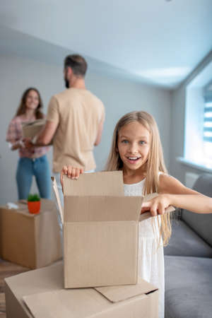 New house. Family unpacking their stuff in a new house and feeling goodの写真素材