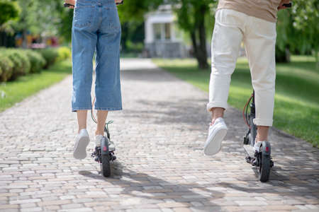 Leisure. Close up picture of a couple riding scooters