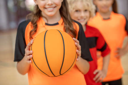 Basketball. Close up picture of kids with a ballの写真素材