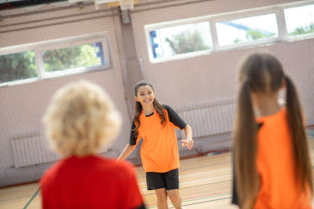 In the gym. Kids in bright sportswear training in the gymの写真素材