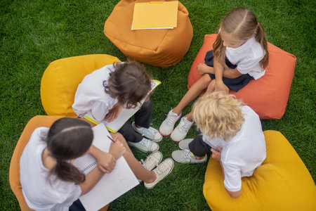 Project work. Pupils working together on a project and feeling involvedの写真素材