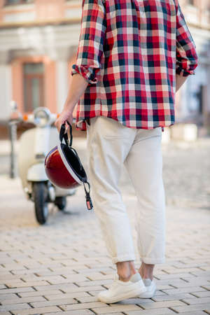 Retro style. A man holding a stylish red retro helmetの写真素材