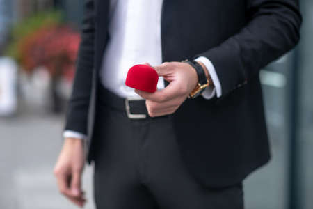 Proposal. Close up picture of a man holding a box with a ringの写真素材