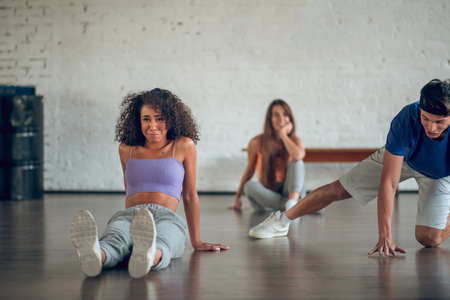 Learning choreography. A tired woman learning parterre dance during the dance classの写真素材