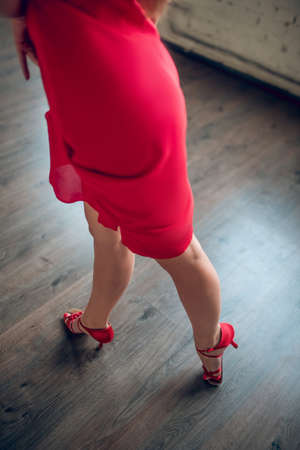 The color of passion. An elegant and skilled female dancer wearing red dressの写真素材