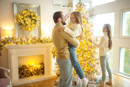 Happy father. Father holding his kid and feeling happyの写真素材