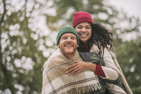 Autumn date. A young and active couple enjoying the dateの写真素材