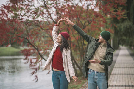 Outdoor date. A young couple having fun while walking together