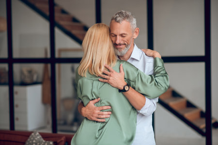 Man and woman hugging each other and feeling happyの写真素材