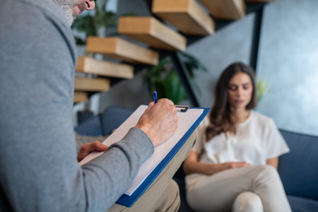 Family issues. A woman talking to therapist about family issuesの写真素材