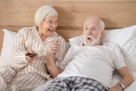 Leisure. Grey-haired woman and her husband resting at homeの写真素材