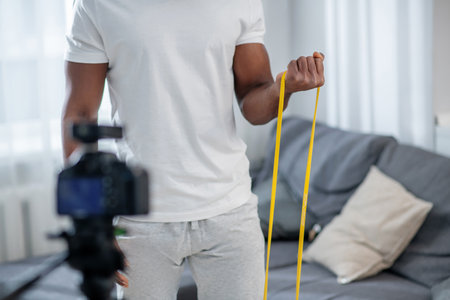 African american young man demonstrating sport equipmentの写真素材