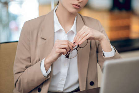 Business lady sitting at the table in the office