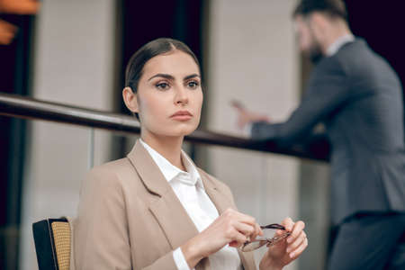 Business lady sitting at the table in the officeの写真素材