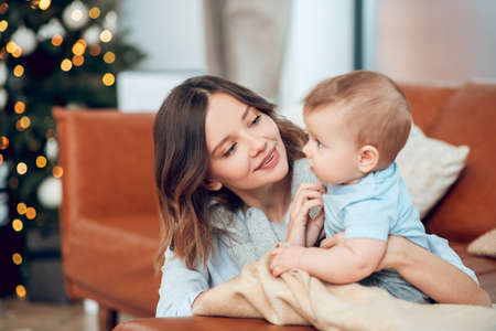 Pretty woman chatting with her little childの写真素材