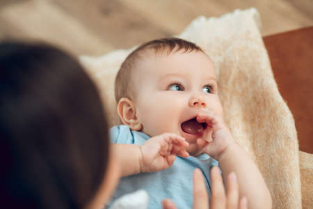 Close up face of cute baby with open mouth